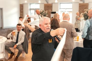 Singing Waiter with napkins